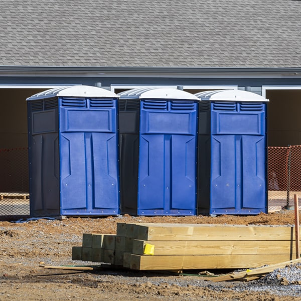 what is the cost difference between standard and deluxe portable restroom rentals in Sparta